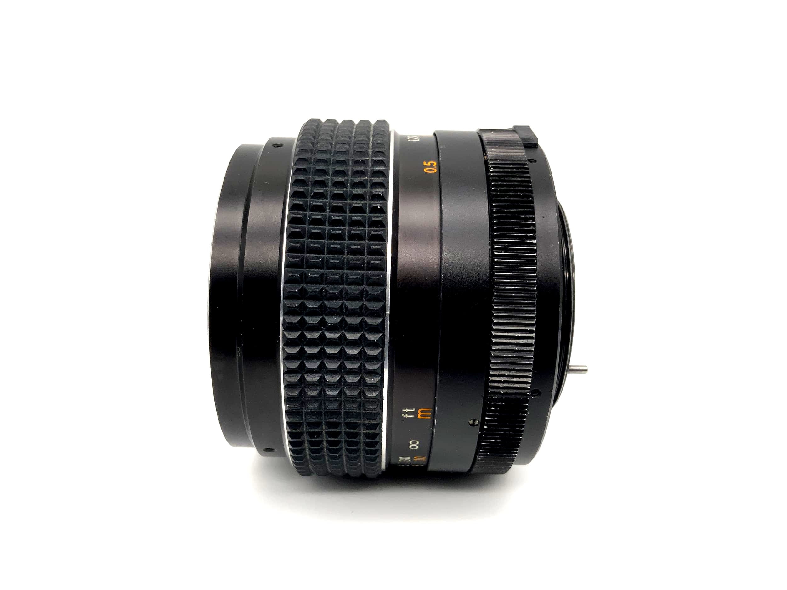 Objectif Tomioka 55 mm 1:1.4 Chinon Auto Multi-Coated Bokeh (M42)
