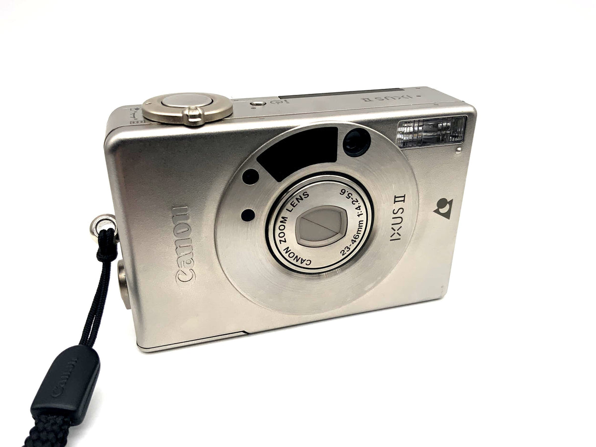 Appareil photo compact Canon IXUS II avec objectif zoom 23-46 mm f/4,2-5,6, format APS-C