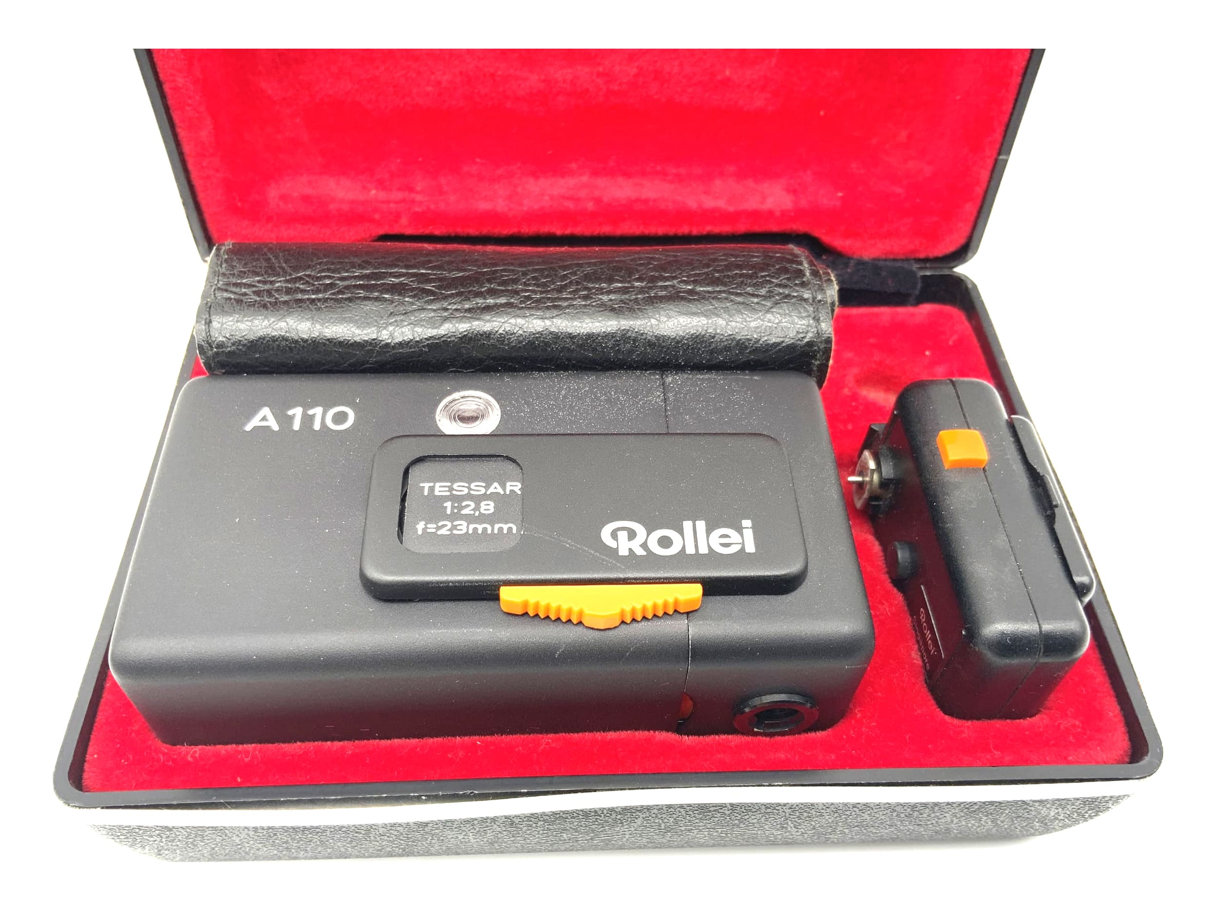 Rollei A110 with Tessar 1:2.8 f=23mm lens, with case, bag and flash spy cam