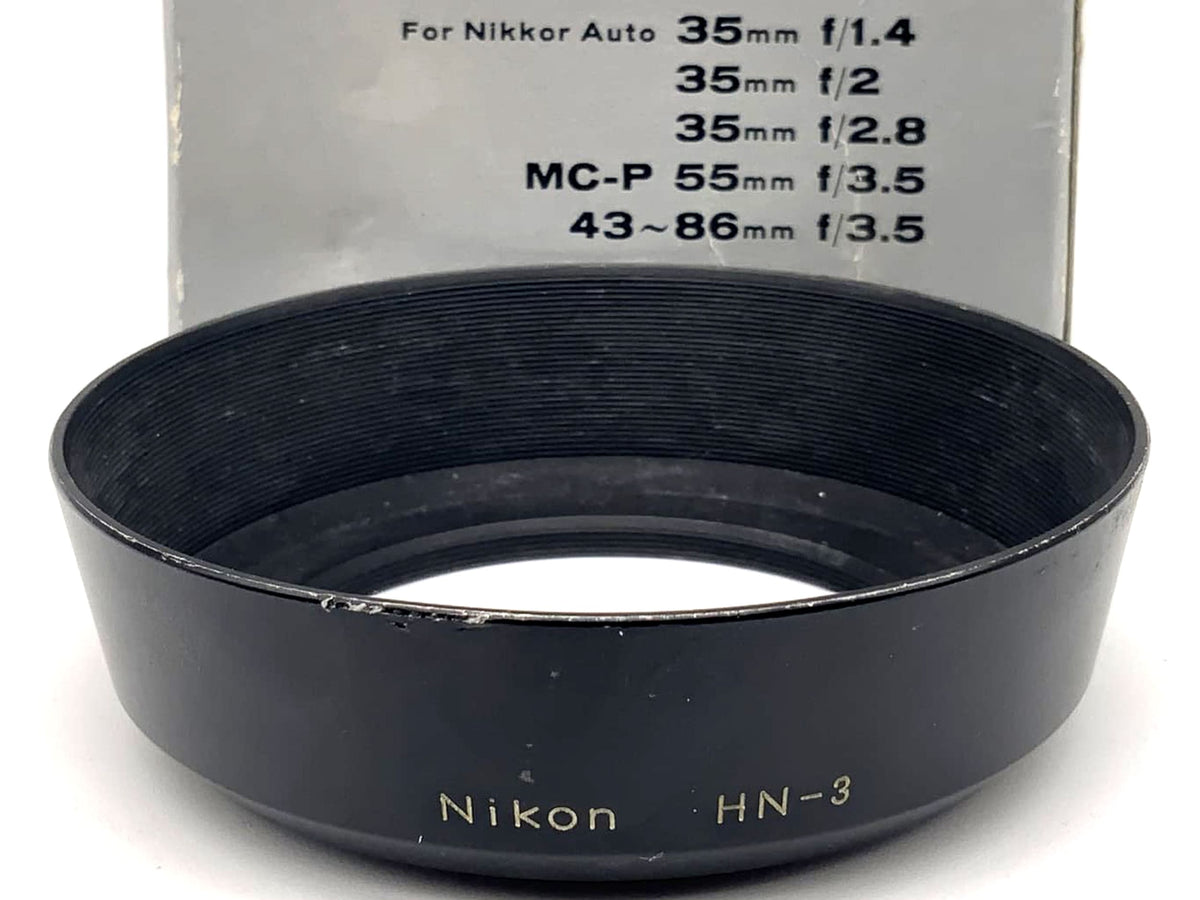 Pare-soleil Nikon HN-3 à visser, dans son emballage d'origine, pour objectif Nikkor 35 mm f/1.4, f/2 et f/2.8