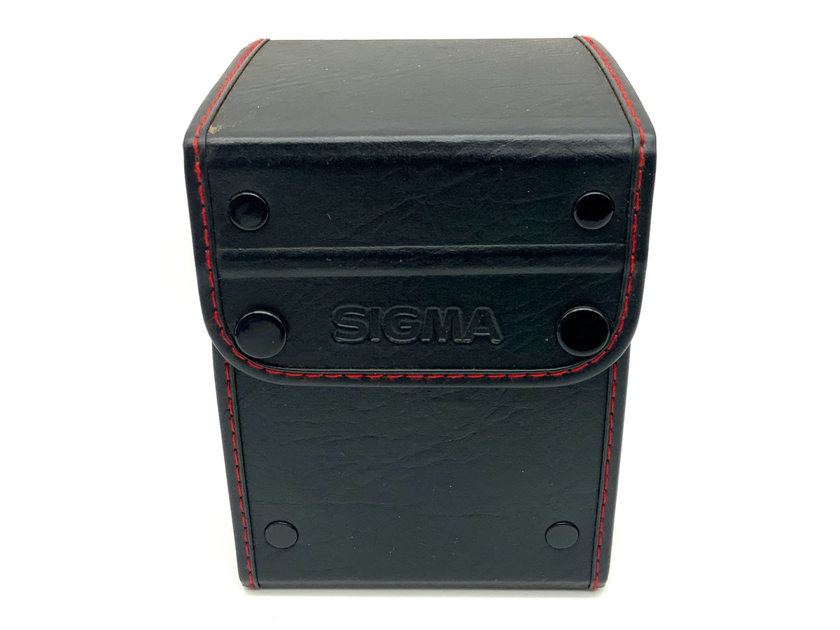 Étui pour objectif Sigma, noir/rouge, env. 14x10cm, étui rigide.