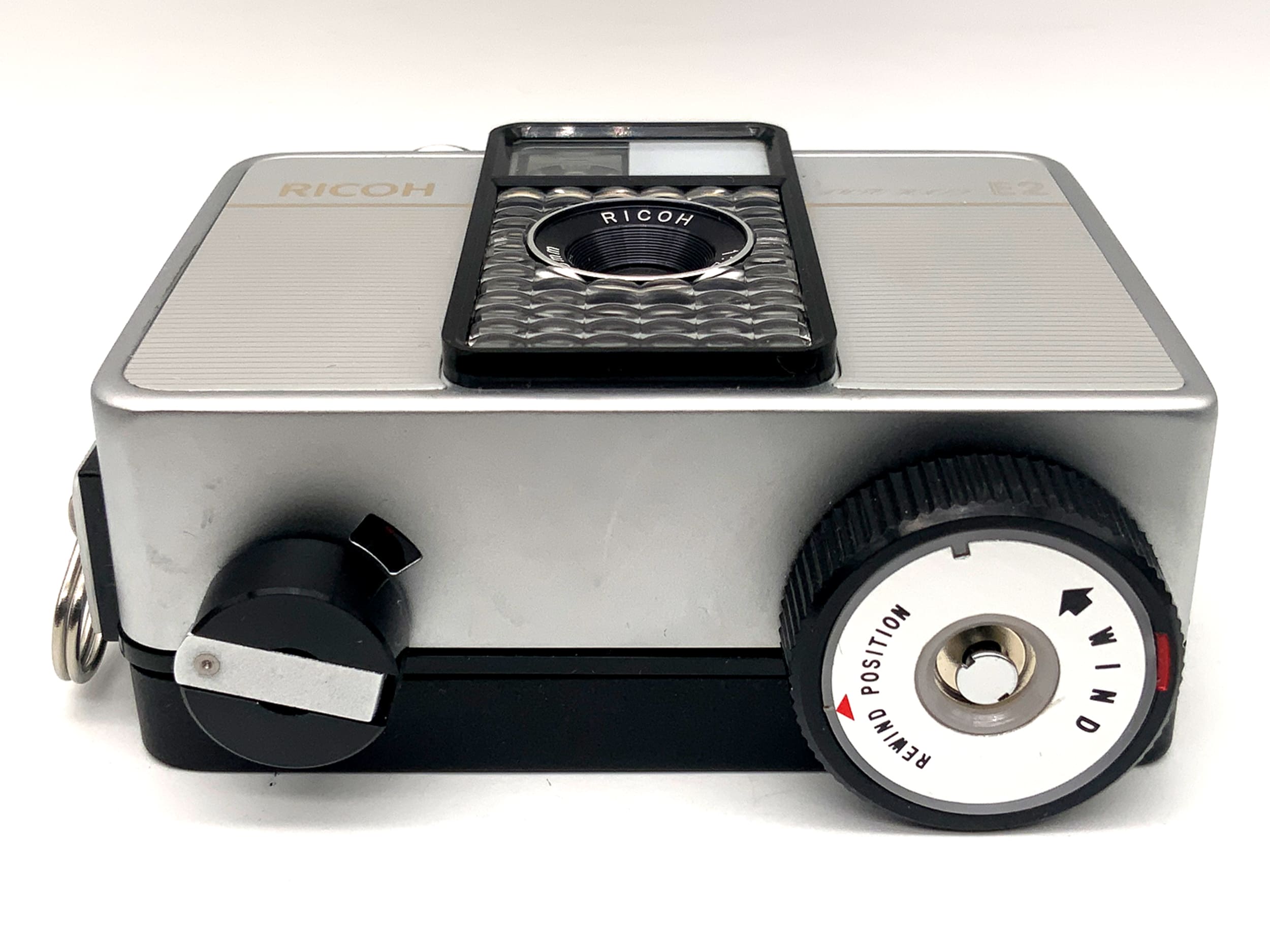 Ricoh Auto Half E2 viewfinder camera with f/2.8 f=25mm half-frame lens in original packaging, analog camera