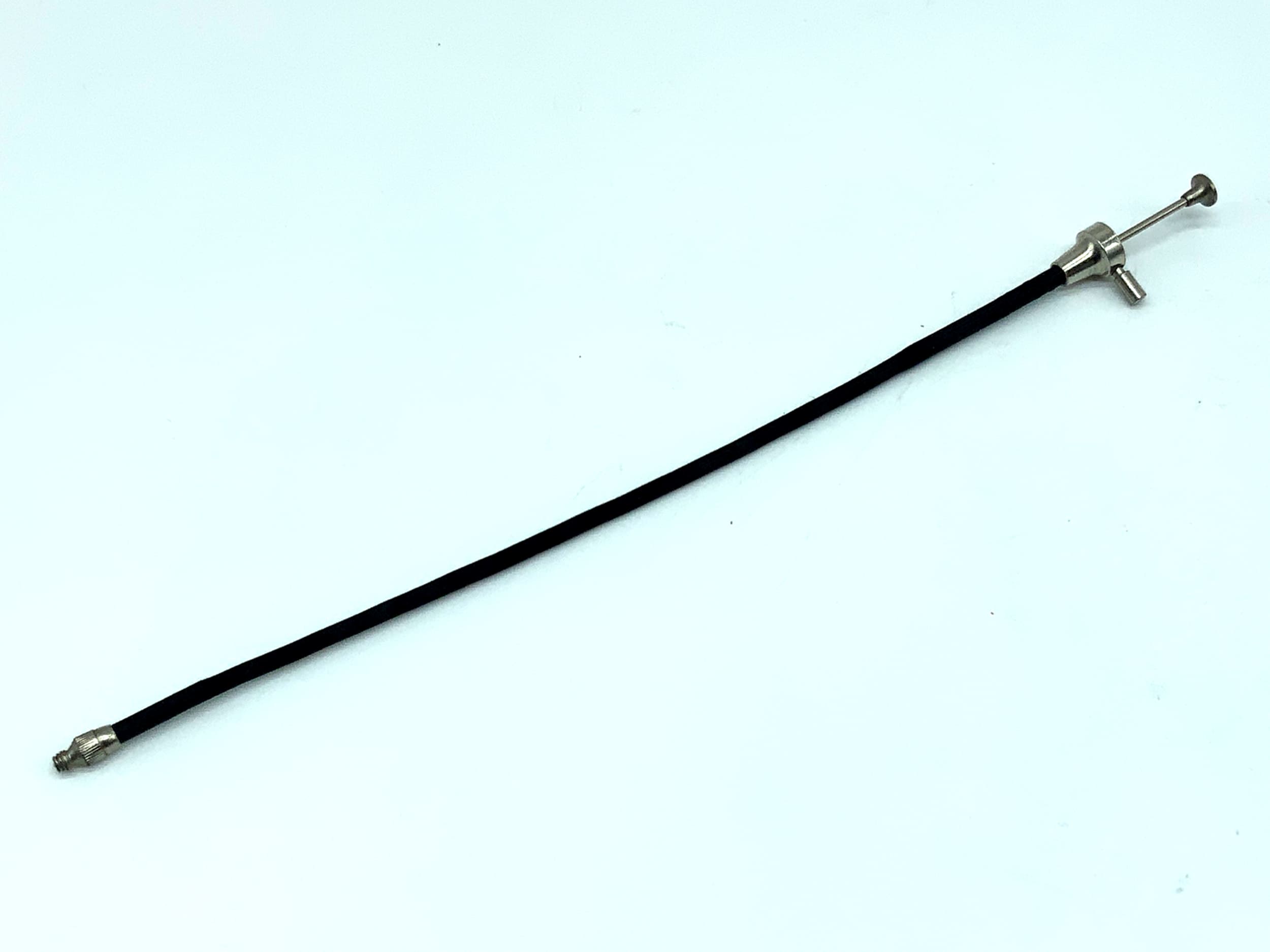 Déclencheur à distance noir, environ 20 cm, avec mécanisme de verrouillage.