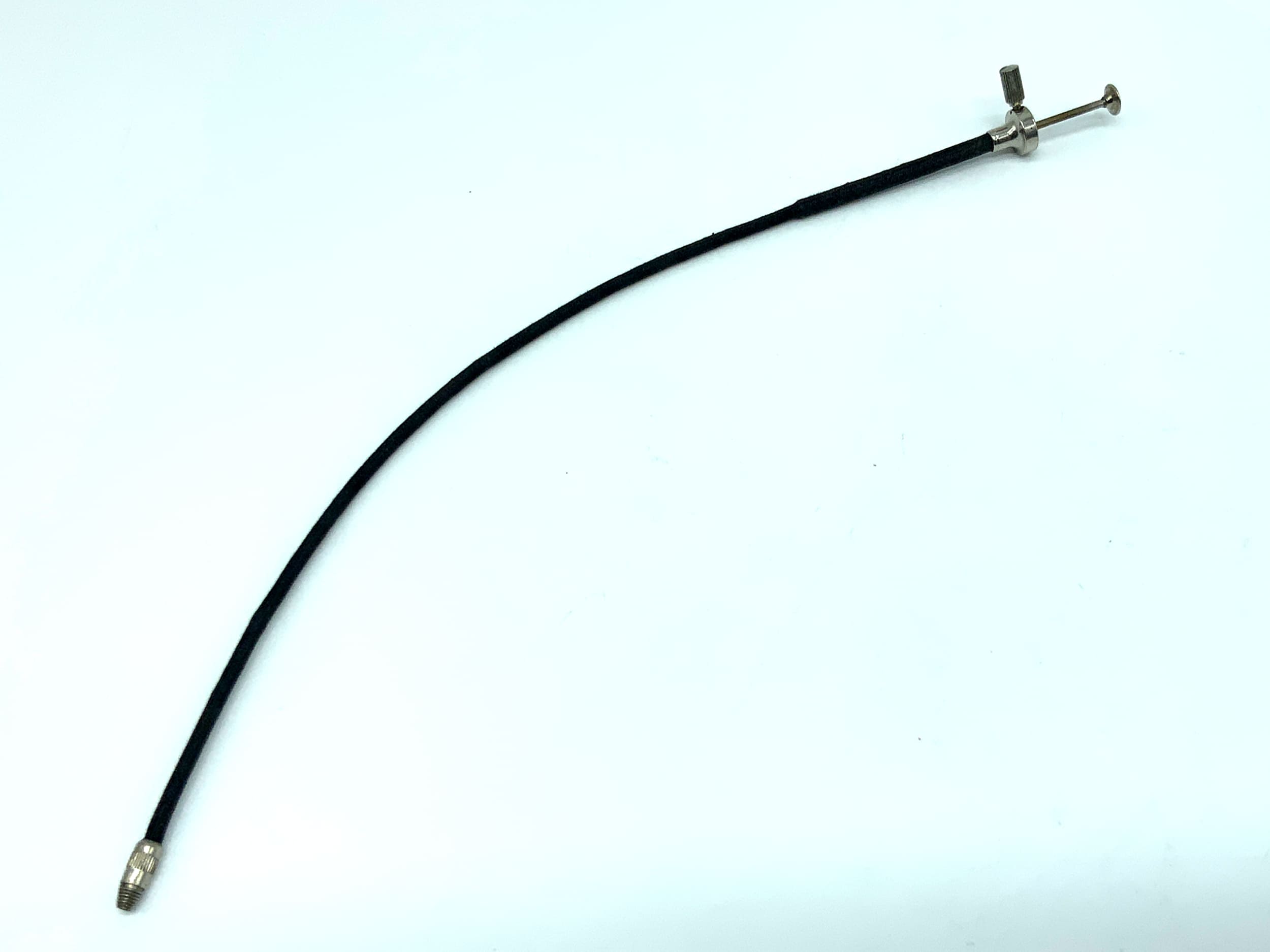 Déclencheur à distance noir, environ 25 cm, avec mécanisme de verrouillage.