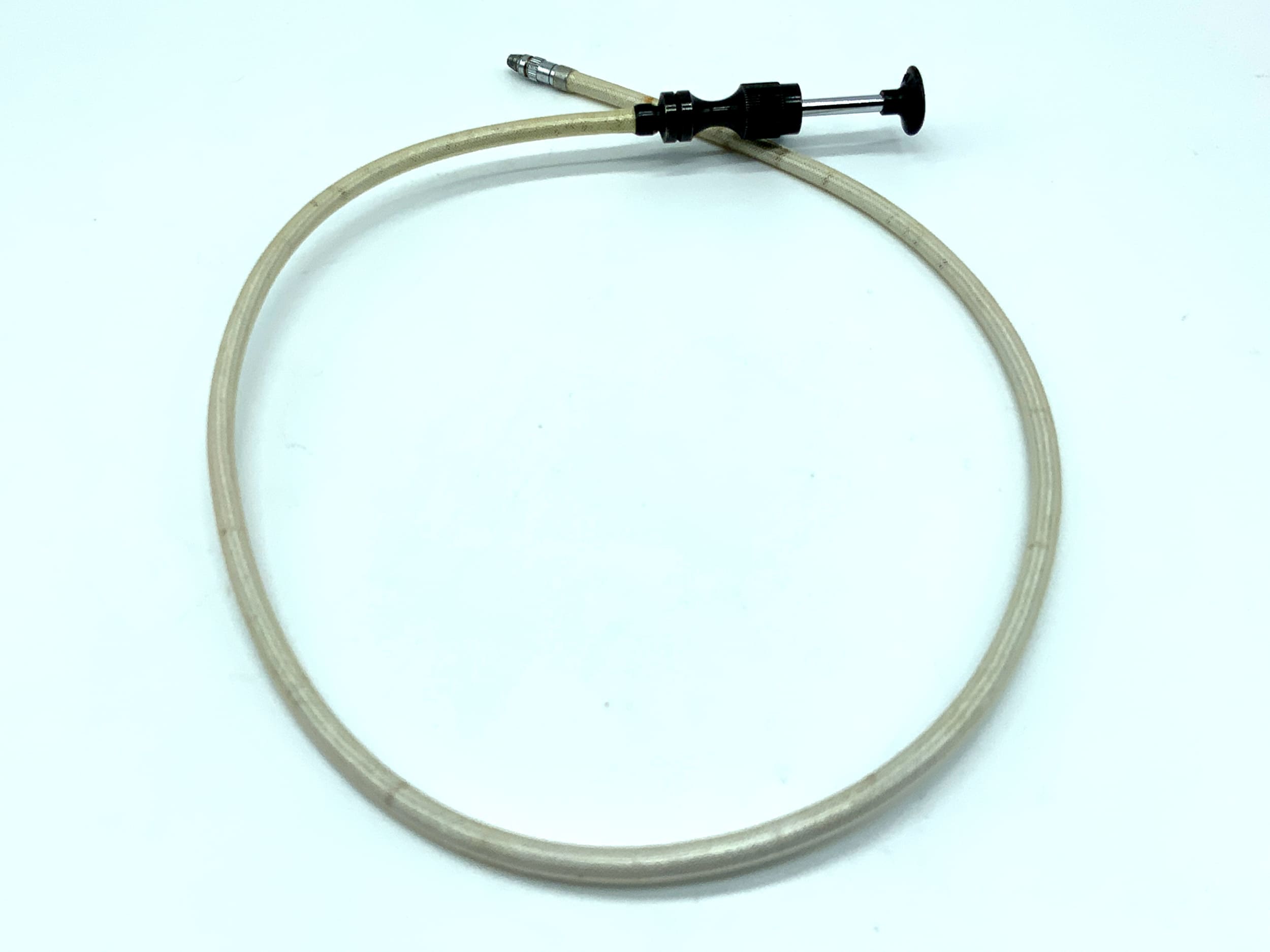 Déclencheur à câble blanc, d'environ 50 cm, avec mécanisme de verrouillage. Déclencheur à câble à distance.