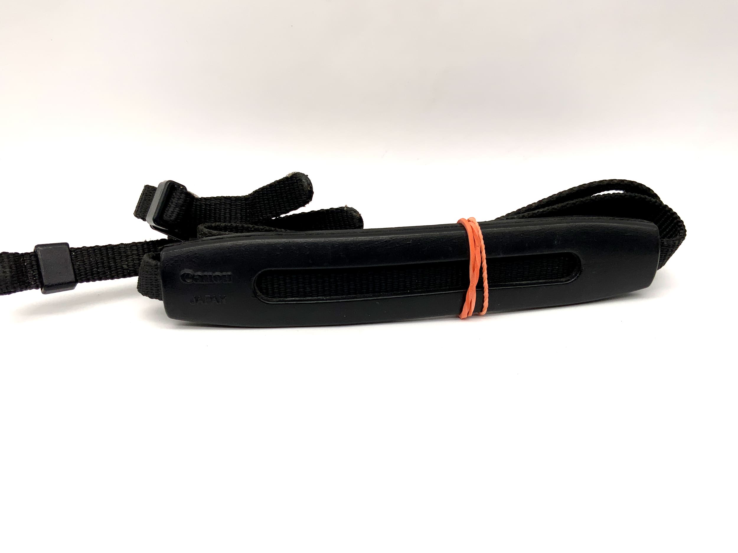 Canon approx. 9mm wide black neck/shoulder camera strap